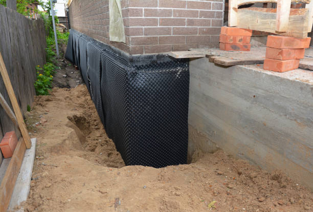 Happy homeowners after waterproofing job in Lennon